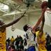 Pioneer senior Aedan York is blocked by Ypsilanti senior Jalen Harmon in the game on Monday, March 4. Daniel Brenner I AnnArbor.com